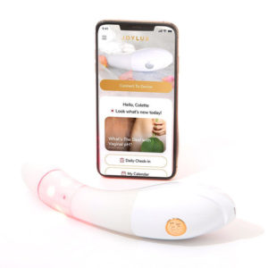 Picture of v fit gold vaginal rejuvenation home device and cell phone showing app